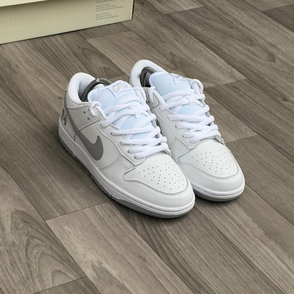 Supreme x Nike SB Dunk Low "White Metallic Silver"